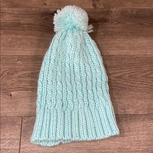 Teal beanie with fuzzy ball